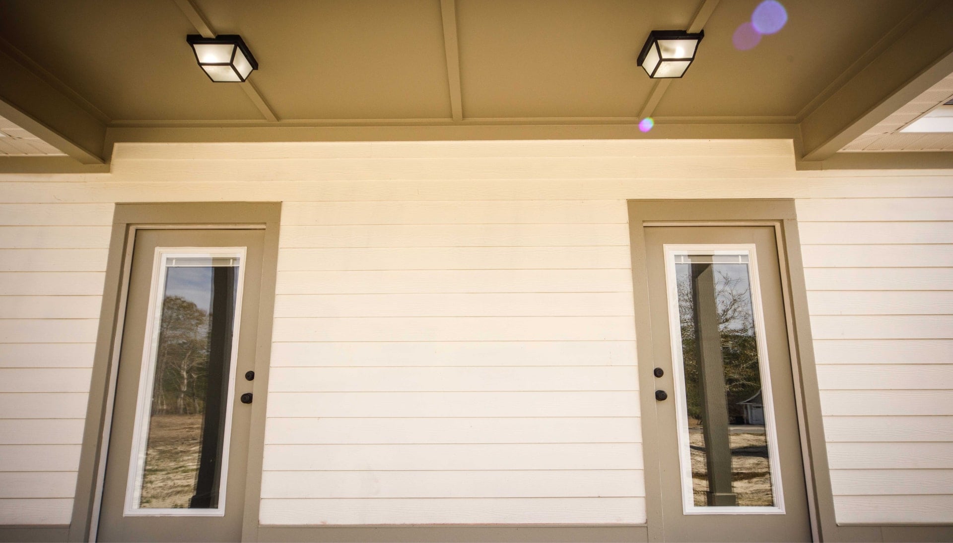 We offer siding services in St. Matthews, Kentucky. Hardie plank siding installation in a front entry way.